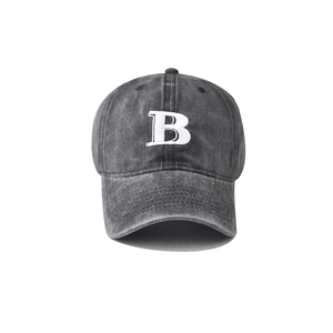 Close-up of 3D embroidered white B letter on vintage washed grey cotton baseball cap