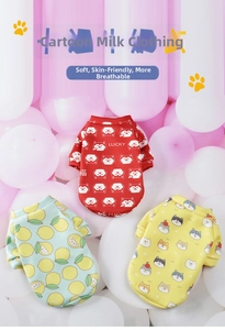 Close-up of soft cartoon printed pet vests in red, blue and yellow on balloon background