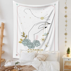 Detail of Scorpio zodiac tapestry with gold floral and celestial elements for wall decor