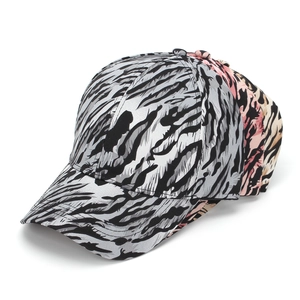 Detail view of animal print baseball caps in grey, pink, and khaki color options