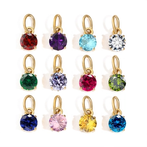 Detailed overview of twelve colorful round cut gemstone pendants with gold jump rings