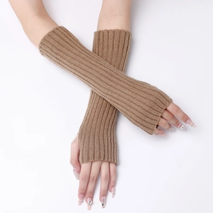 Detail of camel brown knitted arm warmers with classic vertical ribbed stripe texture