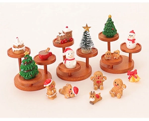 Detailed view of Christmas gingerbread man miniatures and snowmen on wooden stands