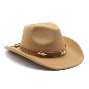 Detail of camel wool western hat with brown leather band and white cross-stitching
