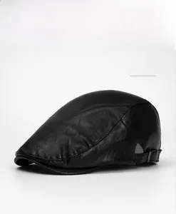Detail view of the black textured PU leather flat cap with metal adjustable back strap buckle