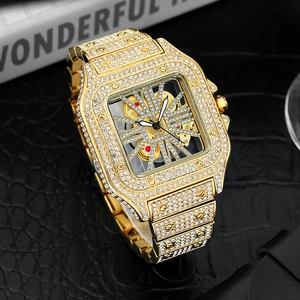 Close-up of luxury gold square watch featuring a hollow dial and full diamond setting