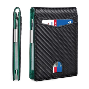 Detail of slim carbon fiber wallet featuring green leather interior and metal money clip