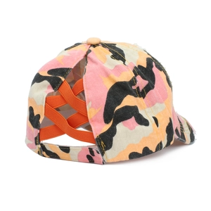 Detail of camo ponytail baseball cap featuring orange criss-cross elastic bands and distressed brim