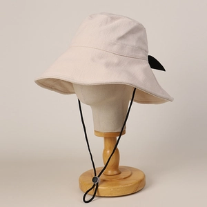 Summer wide-brim linen sun hat for women with black bow and adjustable chin strap