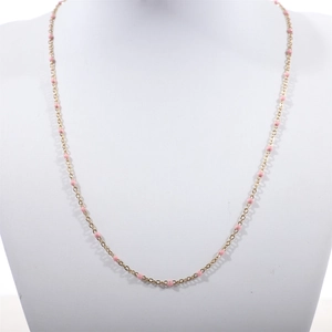 Detail of gold-plated stainless steel chain with pink enamel beads for women