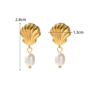 Detail showing 2.8cm gold seashell earrings with pearls on a clean white background