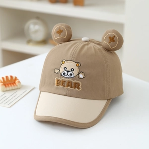 Close-up of cute 3D bear ears and animal embroidery on cotton baby baseball cap