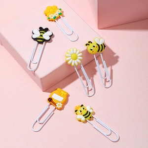Cute bee and sunflower PVC paperclips set with honey bee theme on pink pedestals