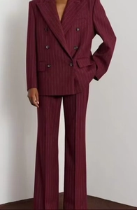 Detail of burgundy pinstripe double-breasted blazer and trousers suit set for women