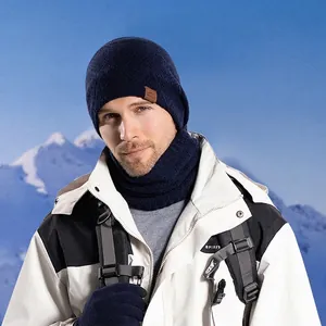 Navy blue winter set including a knit hat, neck gaiter, and gloves for outdoor protection