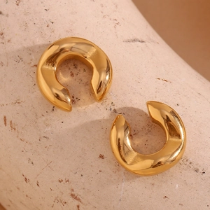 Detailed view of 18K gold plated C-shaped chunky earrings with molten lava texture