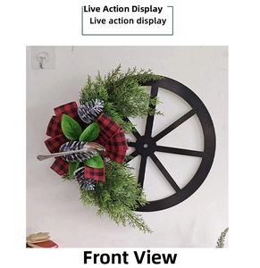 Macro detail of Christmas wheel wreath with pine cones, spoons and red plaid bow decoration