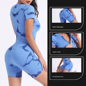 Blue tie-dye yoga jumpsuit with zipper front and peach hip lifting design details