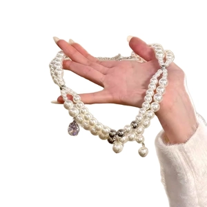 Elegant double-layered pearl necklace with purple zircon drop pendant for women