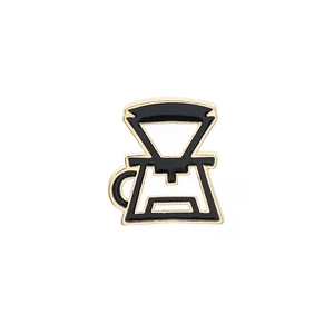 Retro black enamel coffee dripper and server badge with a polished gold finish