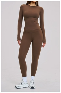 Detail of dark brown high-waist yoga pants with seamless stretch and supportive fabric