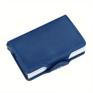 Detailed close-up of dark blue leather RFID wallet with double-layer automatic pop-up slots