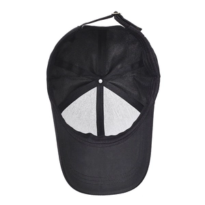 Inside view of black cotton baseball cap with mesh lining and adjustable metal buckle strap