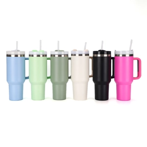 Row of colorful 40oz stainless steel tumblers with handles and straws in multiple colors