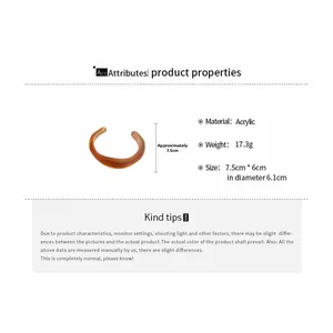 Detail showing amber acrylic irregular open bangle with weight and size specifications
