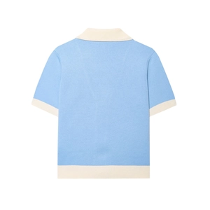 Flat lay of a light blue knit polo shirt with contrast beige trim shown from the back view