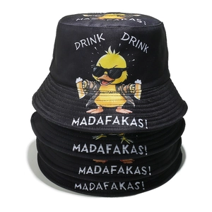 Detail of stacked black cotton bucket hats with yellow duck and DRINK DRINK printing