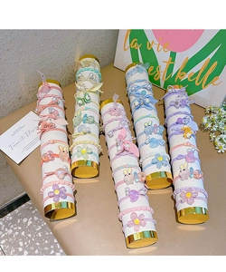 Detail of colorful children hair ties set with floral and animal acrylic charms