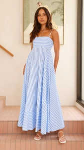 Detail of blue striped backless maxi dress with a flowy skirt and loose fit design