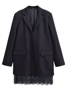 Detail of elegant black blazer dress with delicate lace trim at the hemline