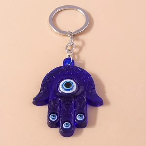 Detail of Hamsa Hand keychain with blue evil eye charms and silver metal ring