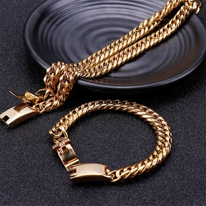 Classic gold Cuban link necklace and bracelet set with sturdy box clasps on black display