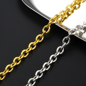 Macro view of gold and silver plated stainless steel oval link chains with metallic shine