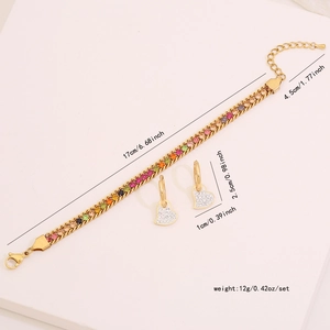 Detail view of gold crystal heart earrings and bracelet set with size measurements