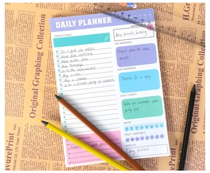 Macro view of a colorful daily planner with goal tracking and habit monitoring sections
