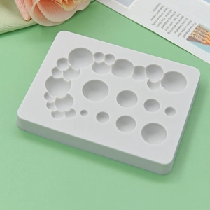 White silicone mold for baking DIY cakes featuring multiple sized bubble bubble designs