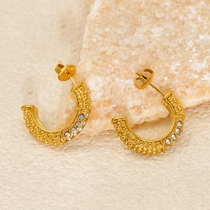 U-shaped gold stainless steel earrings with textured relief and embedded rhinestones