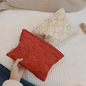 Quilted makeup bag with cute rabbit pattern in red and cream white nylon fabric