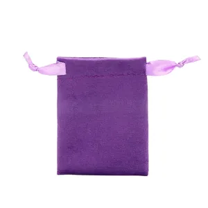 Macro detail of soft purple velvet drawstring pouch showing smooth texture and satin cords