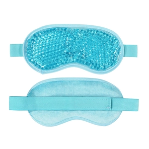 Detail of blue cooling gel eye mask showing gel beads and soft plush backing