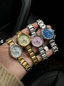 Close-up of Scottie women's watches with metal straps and elegant floral dial designs