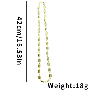 Macro detail of golden beaded necklace with length 42cm and weight 18g specifications