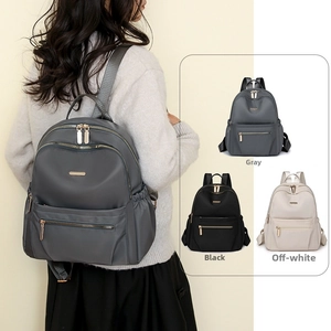 Detail of waterproof nylon backpack showing large storage capacity and metal zippers