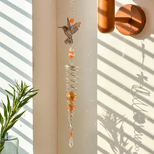 Garden hummingbird suncatcher with metal spiral and faceted orange crystal beads