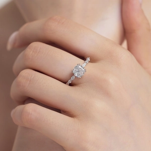 Close-up of S925 sterling silver ring featuring cushion-cut zircon and marquise accents