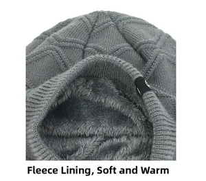 Detail of gray knitted hat showing thick fleece lining and diamond weave pattern